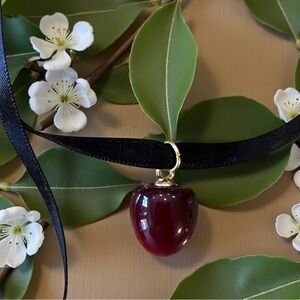 Satin ribbon choker necklace featuring an apple/cherry pendant